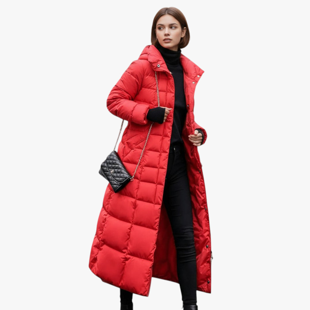 Woman wearing a red puffer coat on a white background