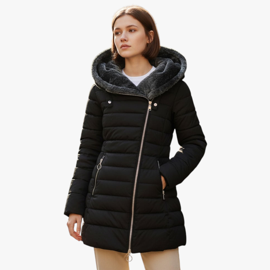 Woman wearing a black puffer coat with gray fur trim on a white background