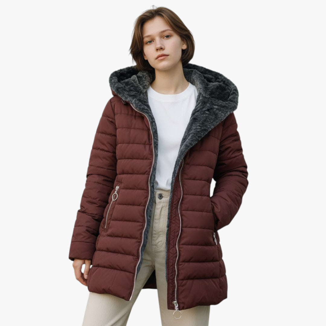 Woman wearing a brown puffer jacket with a fur-lined hood on a white background