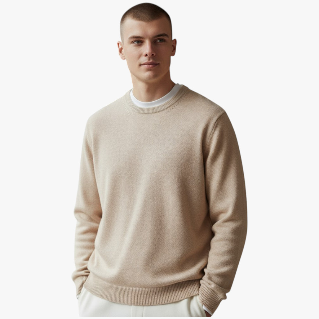 Man wearing a beige sweater on a white background