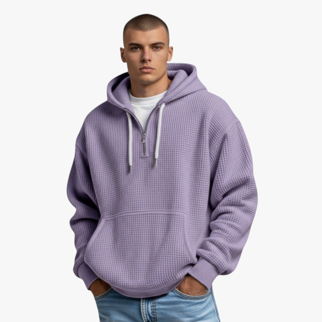 Man wearing a light purple hoodie on a white background