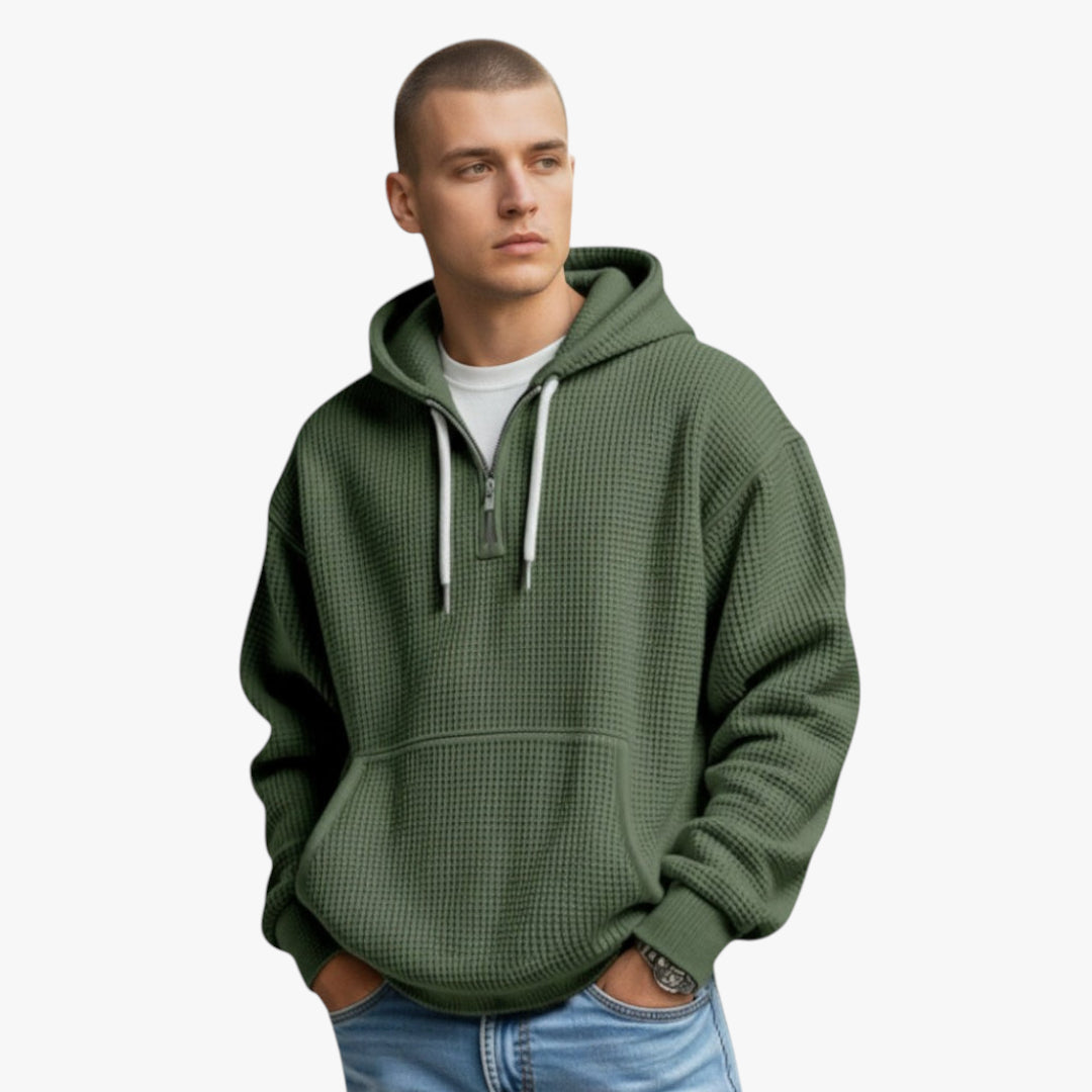 Man wearing a green hoodie on a white background