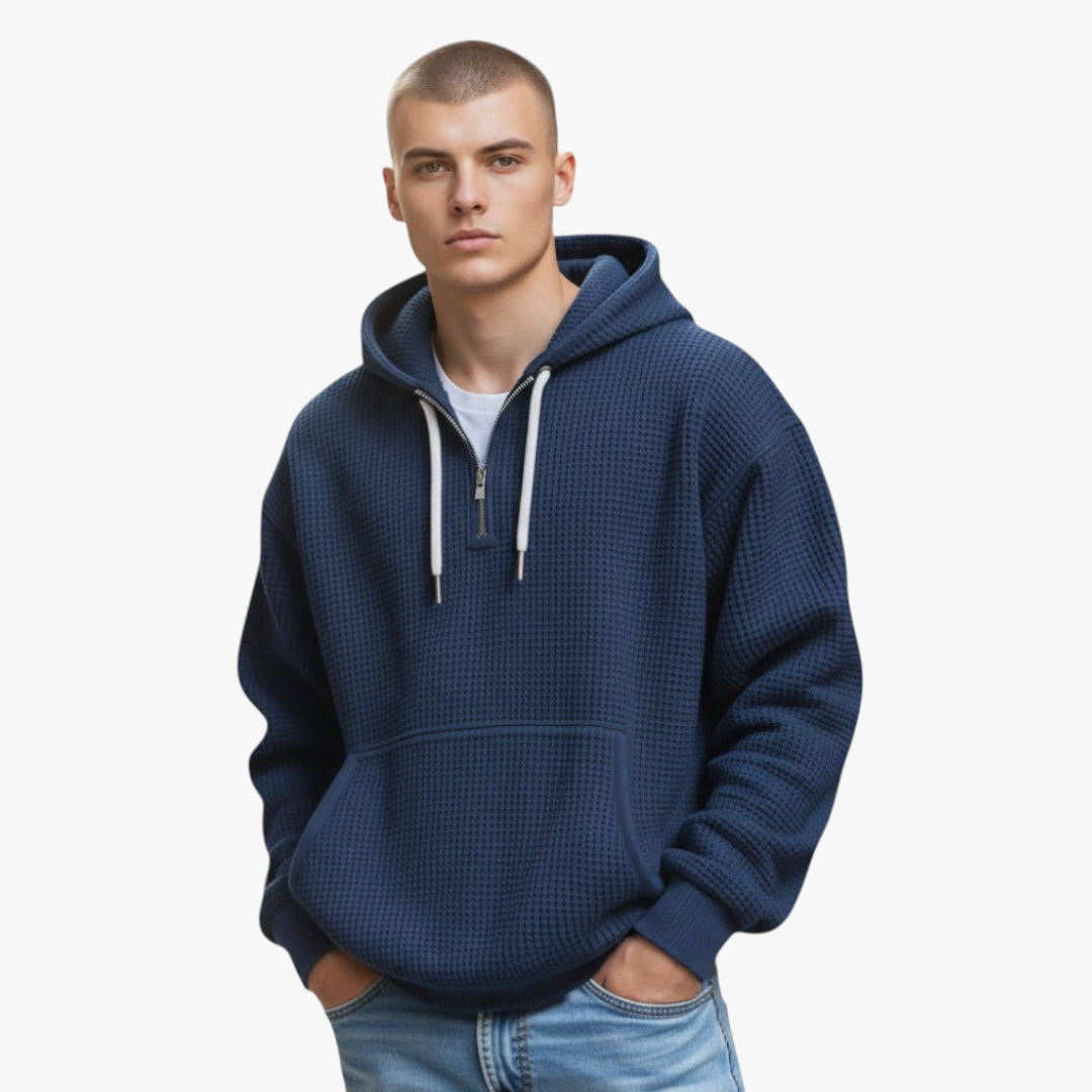 Man wearing a blue hoodie on a white background