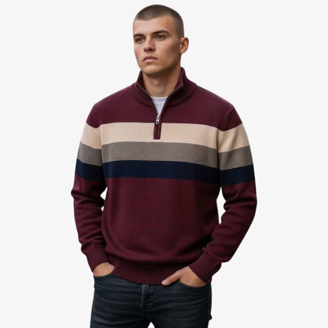 Man wearing a striped sweater with a plain background