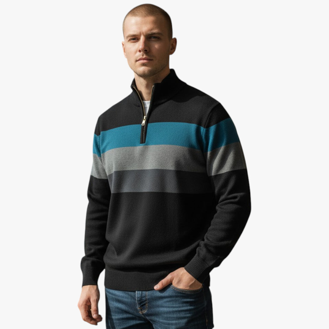 Man wearing a black sweater with blue and gray stripes on a white background