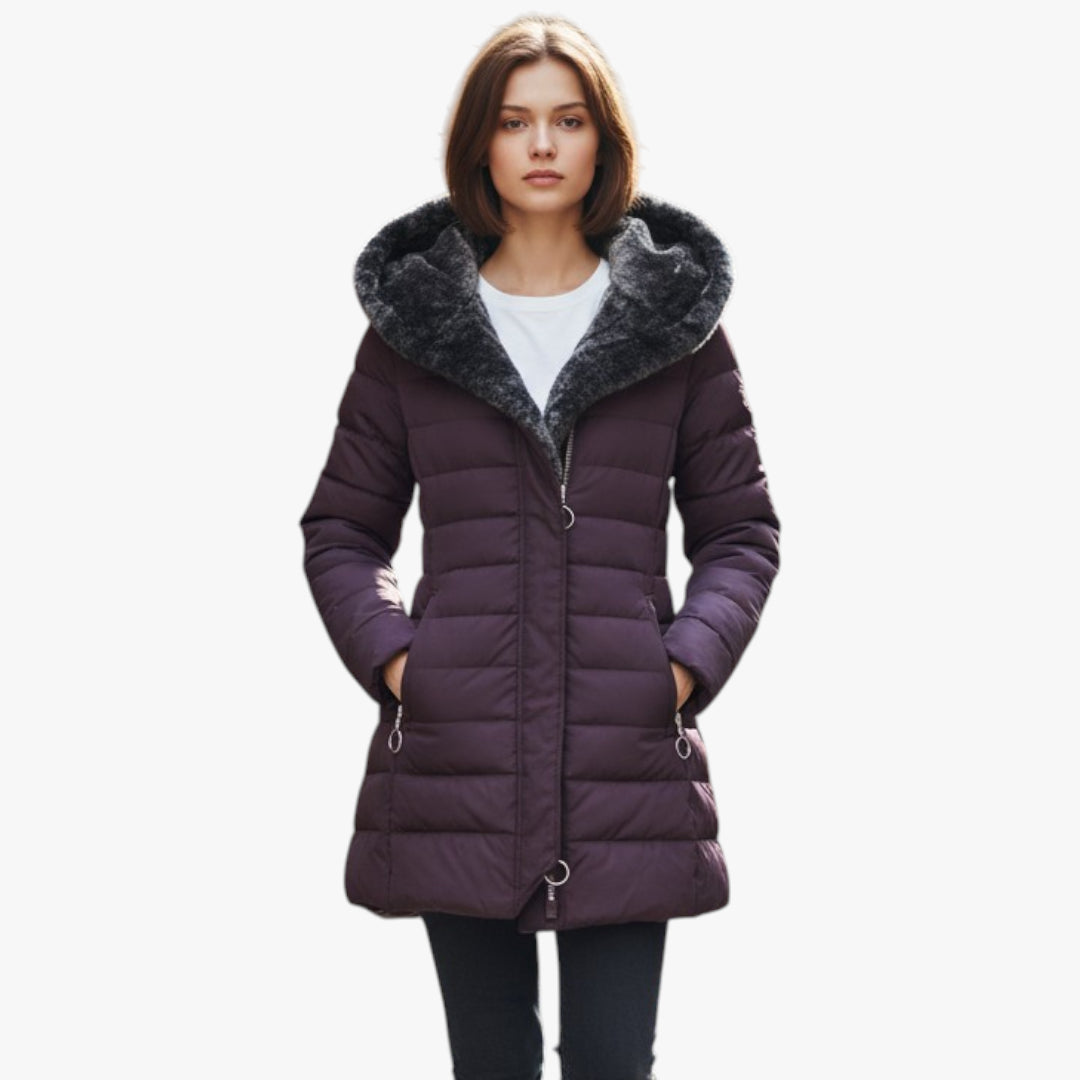 Purple winter coat with fur-lined hood worn by a model on a white background