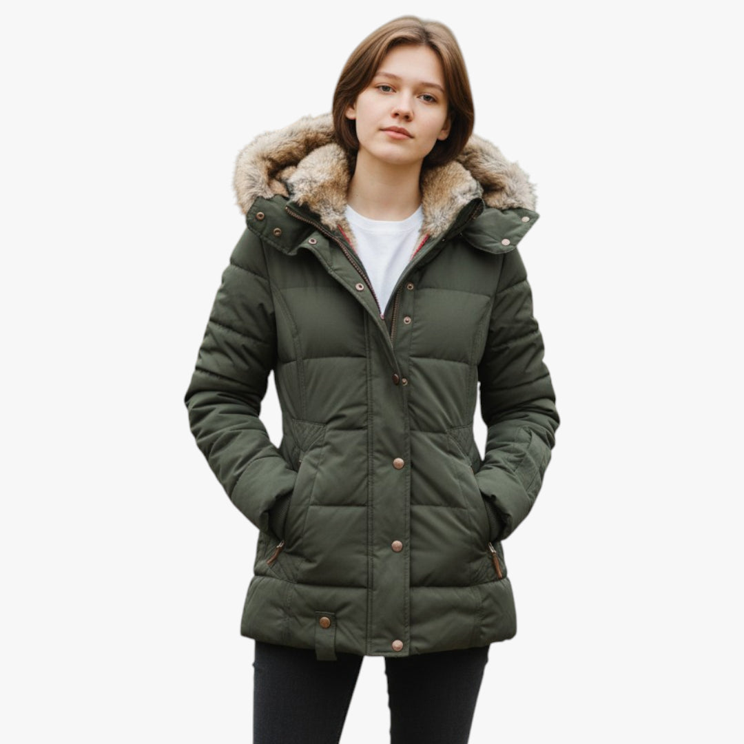 Person wearing a green puffer jacket with fur-lined hood on a white background