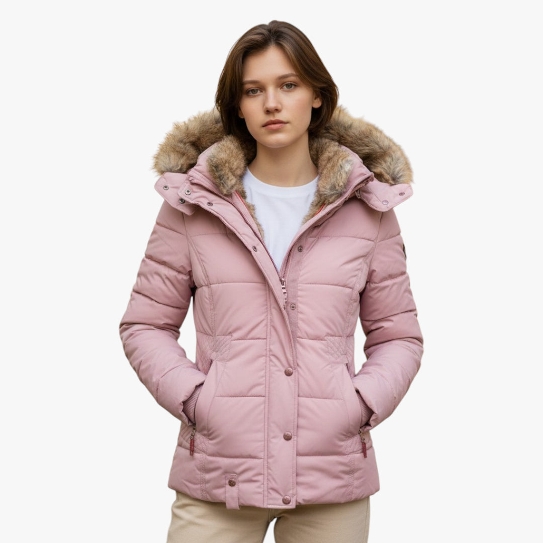 Pink winter jacket with fur hood worn by a model on a white background